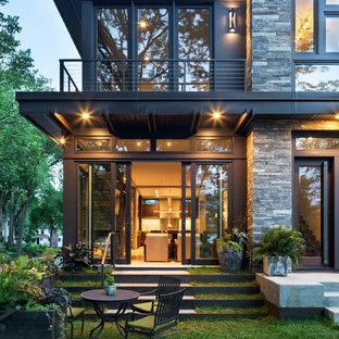 Inspiration for a small modern gray two-story mixed siding flat roof remodel in Minneapolis