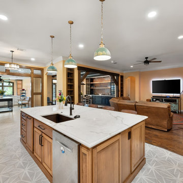 Open Kitchen View Facing Media Wall Stone Fireplace Dining Area