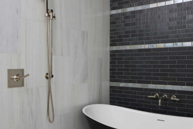 Example of a large transitional master black and white tile porcelain tile, white floor and double-sink bathroom design in Dallas with medium tone wood cabinets, a two-piece toilet, white walls, an undermount sink, a hinged shower door and a built-in vanity