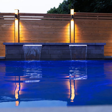 Modern Pool with Water Features & Backyard Landscape Design