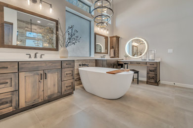 Inspiration for a large transitional master white tile and ceramic tile porcelain tile, beige floor and double-sink bathroom remodel in Phoenix with recessed-panel cabinets, brown cabinets, gray walls, an undermount sink, quartzite countertops, a hinged shower door, white countertops and a built-in vanity