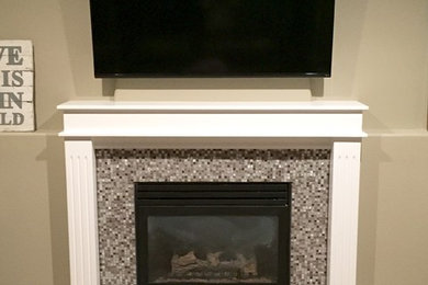 Example of a small transitional open concept ceramic tile family room design in Boise with beige walls, a standard fireplace, a tile fireplace and a wall-mounted tv