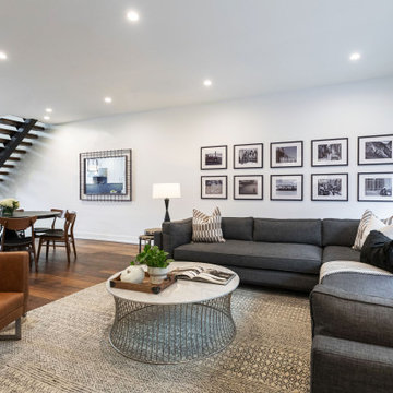 Warm elements like rustic flooring, gallery wall and natural components like cu