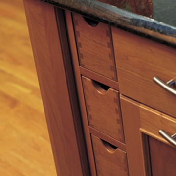 Close Up of Vertical Stacked Apothocary Drawers in a Modern Cherry Kitchen