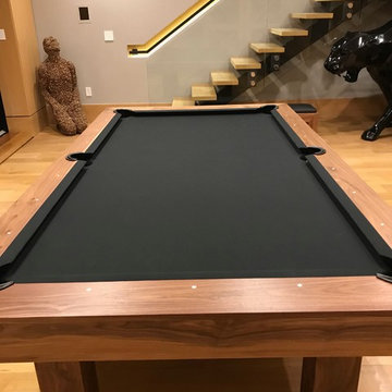 Walnut pool table with a ping pong and dining coversion top
