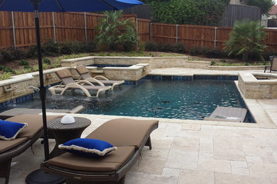Mid-sized country backyard custom-shaped natural pool in Orange County with natural stone pavers.