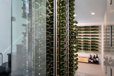 Example of a mid-sized trendy wine cellar design in Orlando with storage racks