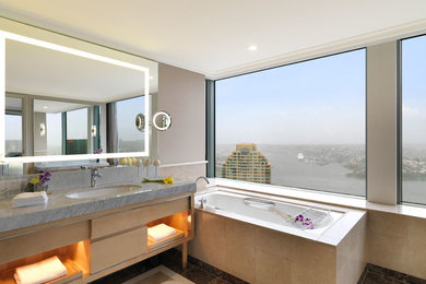 This is an example of a large modern master bathroom in Sydney.
