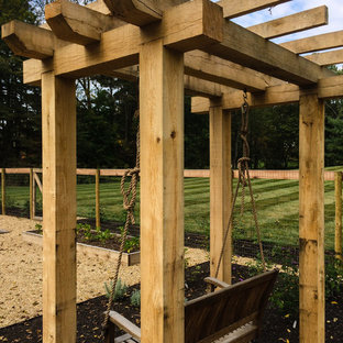 Inspiration pour un jardin potager arrière traditionnel avec une exposition ensoleillée et du gravier.