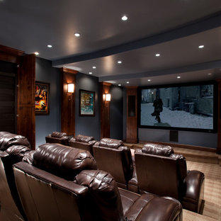Traditional home cinema in Salt Lake City with blue walls and brown floors.