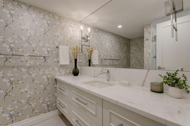 Inspiration for a mid-sized transitional 3/4 bathroom in Calgary with furniture-like cabinets, an alcove shower, a two-piece toilet, multi-coloured tile, stone slab, multi-coloured walls, mosaic tile floors, an undermount sink, engineered quartz benchtops, grey floor, a hinged shower door, multi-coloured benchtops, a single vanity, a floating vanity and wallpaper.