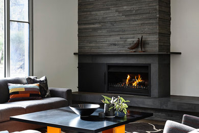 Large transitional open concept living room in Melbourne with white walls, carpet, a stone fireplace surround and a ribbon fireplace.