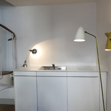 Une pièce à vivre et sa petite cuisine stylée