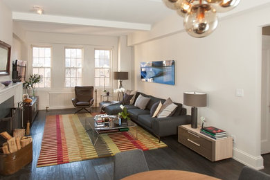 Inspiration for a large eclectic loft-style dark wood floor living room remodel in Other with white walls, a standard fireplace, a wood fireplace surround and a wall-mounted tv