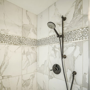 Close Up - Shower Tile & Faucets.