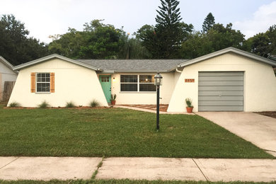 Inspiration for a mid-sized mediterranean exterior home remodel in Tampa