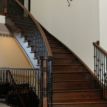 Flared Gothic Wooden Staircase with Hammered Iron Balusters