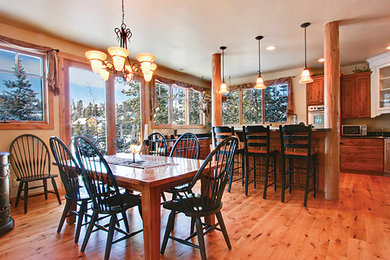 Dining room - large rustic dining room idea in Denver