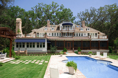 Large trendy backyard brick and rectangular pool photo in Atlanta