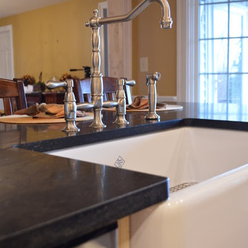 Farmhouse apron sink and soapstone granite