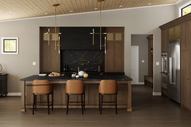 Open concept kitchen - mid-sized transitional l-shaped medium tone wood floor, brown floor and vaulted ceiling open concept kitchen idea in Chicago with an undermount sink, shaker cabinets, medium tone wood cabinets, quartz countertops, black backsplash, quartz backsplash, stainless steel appliances, an island and black countertops