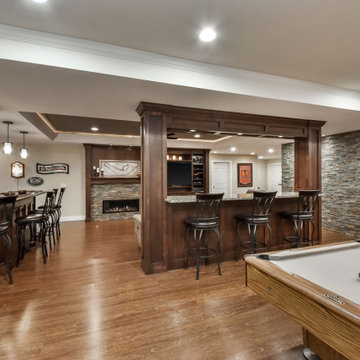 Elegant Basement Remodel with Custom Bar, Game Room & Fireplace