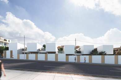マドリードにあるお手頃価格のモダンスタイルのおしゃれな家の外観 (漆喰サイディング、タウンハウス、緑化屋根) の写真