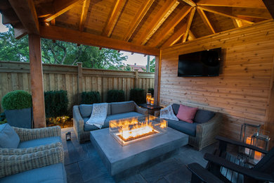 Example of a transitional patio design in Toronto