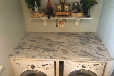Laundry room - laundry room idea in Other with granite countertops and gray countertops