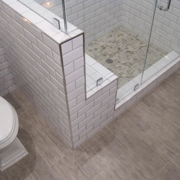 Shower. with colorful pebble stone flooring