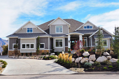 Inspiration for a large transitional gray two-story mixed siding exterior home remodel in Salt Lake City with a shingle roof