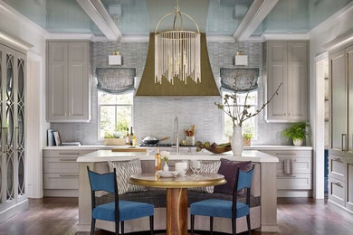 Example of a mid-sized classic single-wall dark wood floor and brown floor eat-in kitchen design in Atlanta with recessed-panel cabinets, gray cabinets, quartz countertops, gray backsplash, an island and white countertops