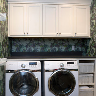 Inspiration for a large midcentury u-shaped separated utility room in Charlotte with recessed-panel cabinets, white cabinets, onyx worktops, a side by side washer and dryer, a submerged sink, blue walls and slate flooring.