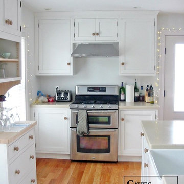 White Eclectic Kitchen with Two Tiered Peninsula