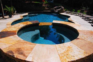 Medium sized contemporary back custom shaped swimming pool in Atlanta.
