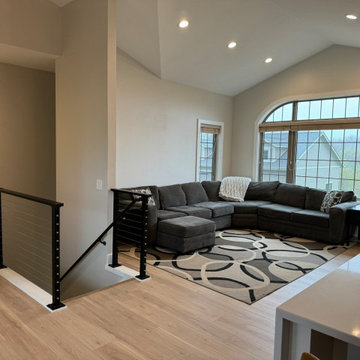 Bright Vaulted Living Room with Contemporary Cable Railing - St. Michael Remodel