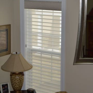 Two story treatments - Lower window shades and Short Cornices decorate top heade