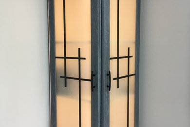 Mid-sized minimalist 3/4 bathroom photo in Chicago with flat-panel cabinets and gray cabinets