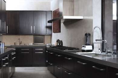 Example of a minimalist kitchen design in Other