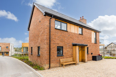 Photo of a medium sized contemporary two floor detached house in Dorset.