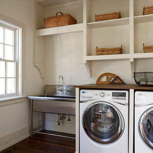 This is an example of a traditional utility room in Other with wood worktops and brown worktops.