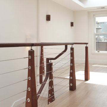 modern wood staircase with wire cables