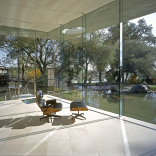 Inspiration for a large modern study in San Francisco with white walls, limestone flooring, no fireplace and a built-in desk.