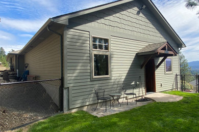 Example of a trendy wood and shingle gable roof design in Seattle