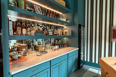Example of a transitional home bar design in Houston
