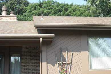 Example of a mid-sized minimalist beige one-story wood exterior home design in Minneapolis