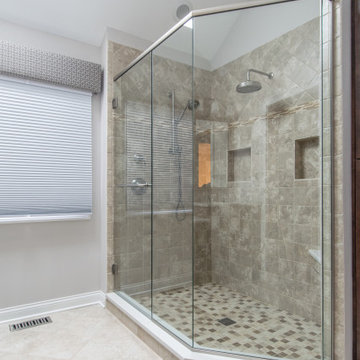 Full Length Glass Walls with Dual Rain Shower Fixtures and Built-In Shower Bench