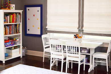 This is an example of a mid-sized modern gender-neutral kids' playroom for kids 4-10 years old in New York with grey walls and dark hardwood floors.