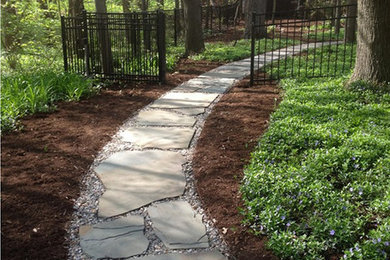 Design ideas for a large shade backyard stone garden path in Other.
