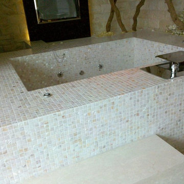 mother of pearl mosaic tile used in bathtub in villa